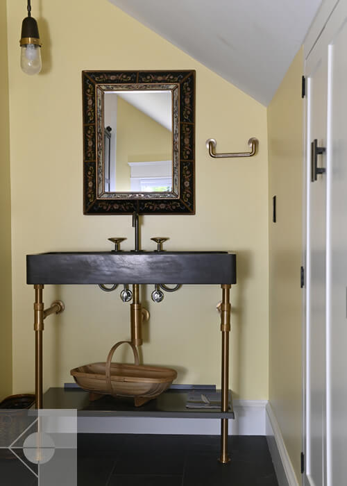 Bathroom vanity and mirror in this St. George, Maine home.