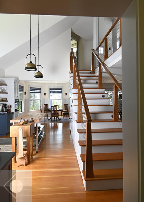 St. George, Maine home looking at the kitchen, dining area and staircase.