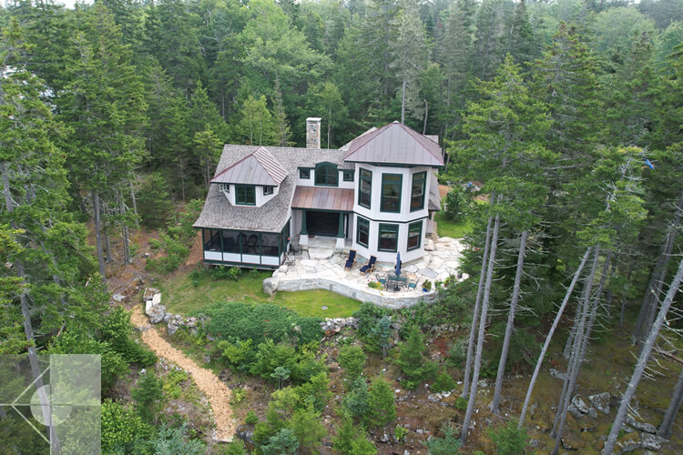Drone view of this St. George, Maine home and fieldstone patio.