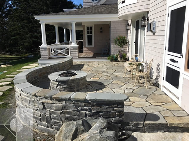 Firepit, curved fieldstone wall and firepit.