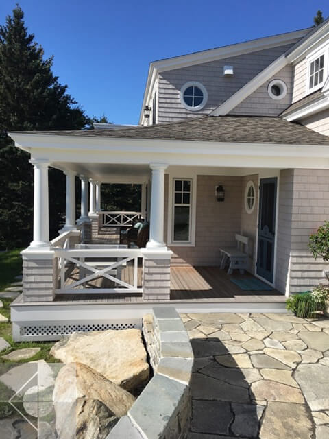 Stone walkway to the covered deck.