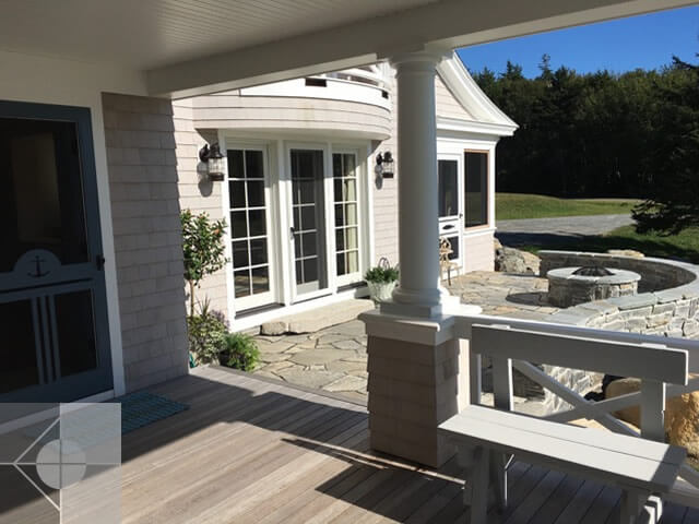 View from the deck to the fieldstone patio and fire pit.