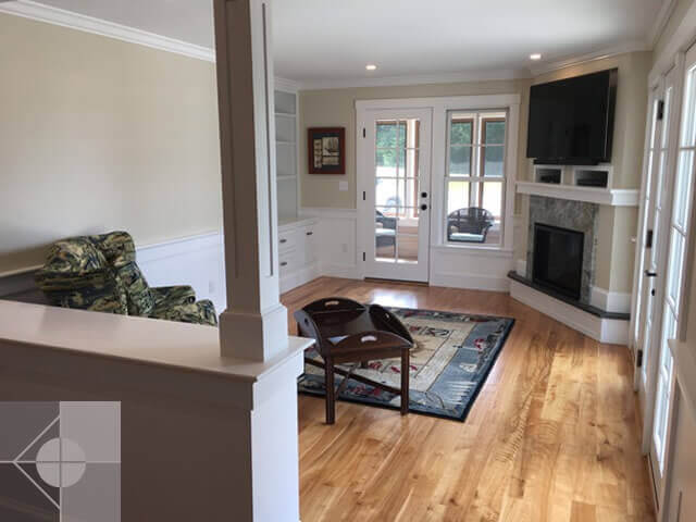Great room with door to the screened in porch.