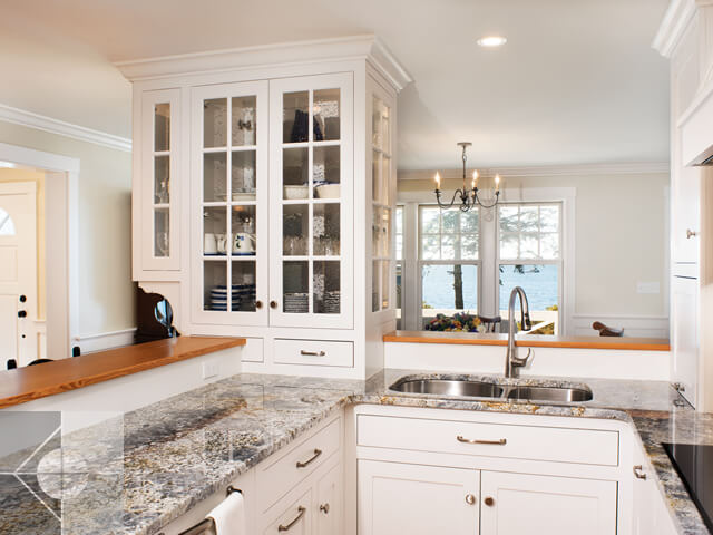 Kitchen with granite countertops, custom cabinets and ocean views.
