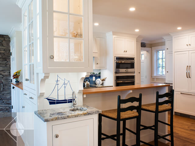 Kitchen with island and built in custom cabinets.