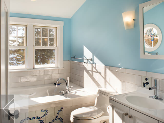 Bathroom with custom tiled tub, also showing the toilet and sink.