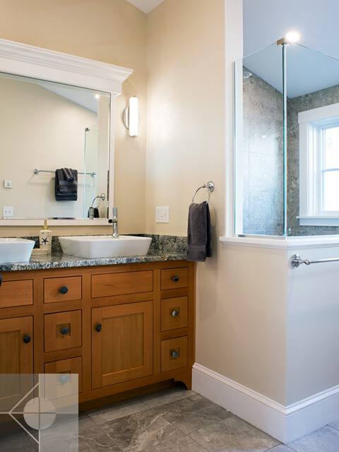 Two bathroom sinks and walk in shower.