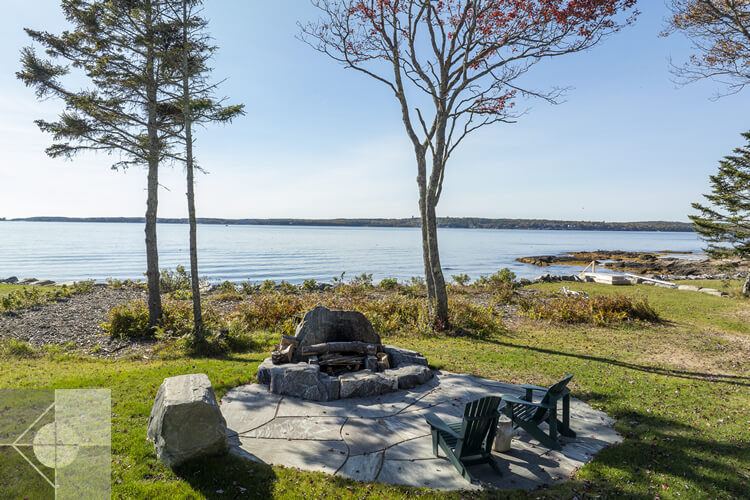 Firepit and sitting area with ocean views.