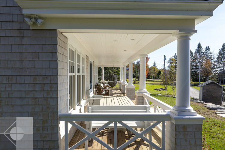 Side view of thecovered deck on this New Harbor, Maine home designed by Phelps Architects.