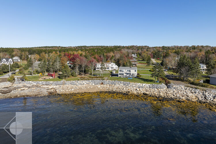 Drone ocean view of this home and surrounding neighborhood.