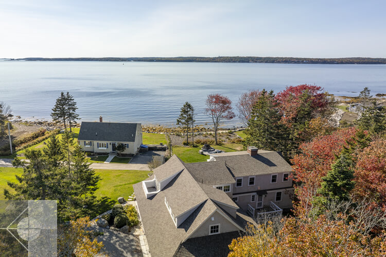Drone view of the roofline and proximity to the ocean.