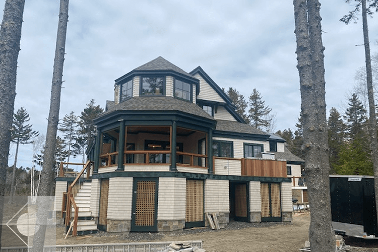 House under constution with a view of the octaganal porch and glassed in second story.